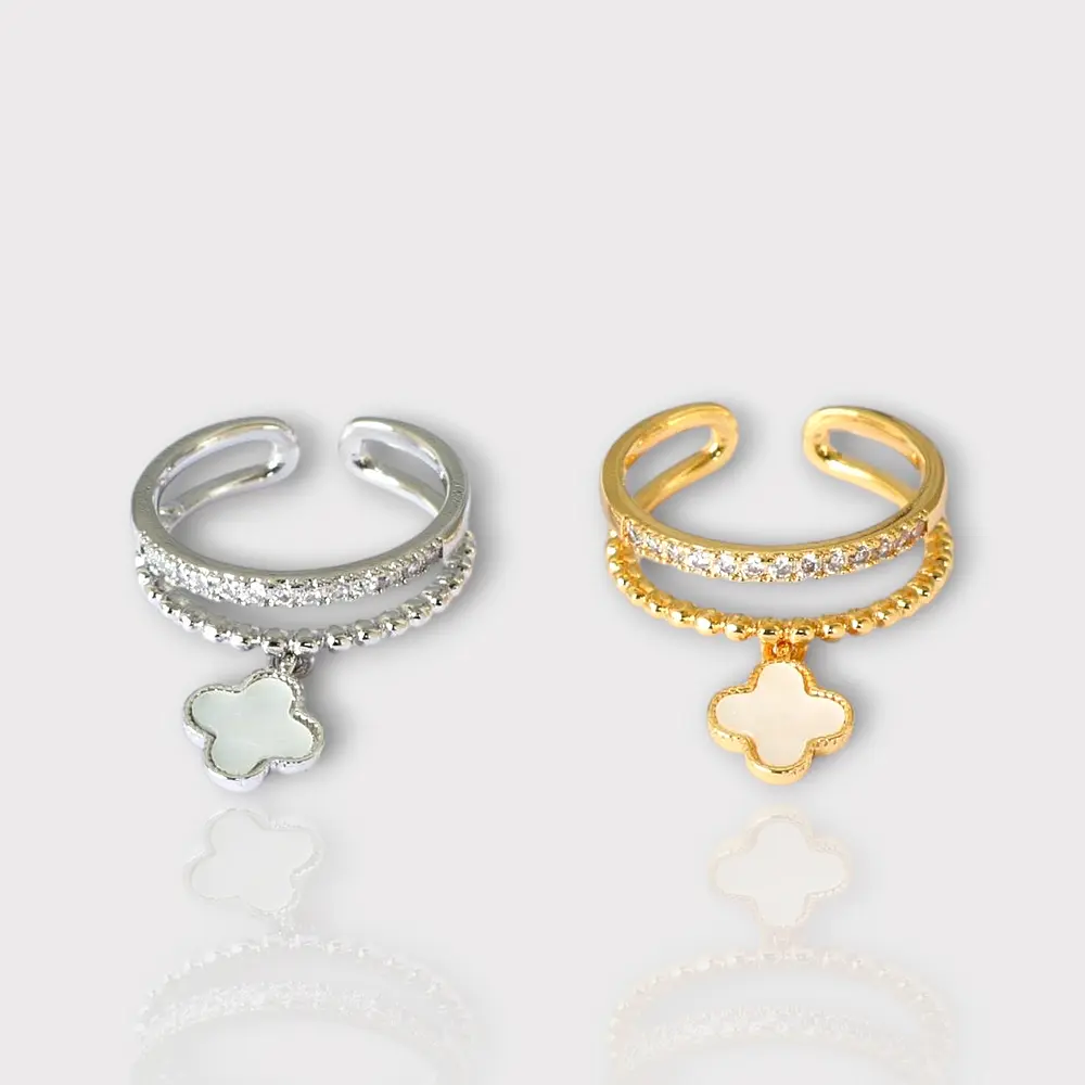 Bague avec trèfle, ajustable. Argenté et doré