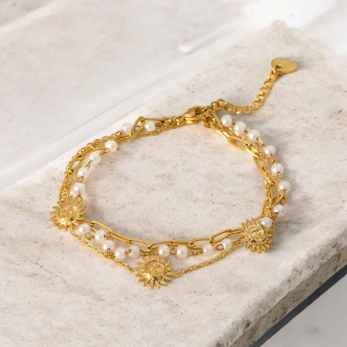Bracelet avec soleil triple chaine doré
